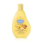 Yellow bottle of baby shampoo and shower gel with 'bobbles' branding on a white background