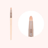 A Flalia Muhly #37 eyehole brush with a beige handle and a beige brush head, displayed against a white background.