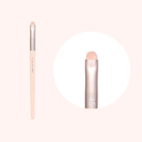 An image showing a Flalia Muhly #45 Point Shadow Brush, with a pale pink handle and a beige brush head, presented against a white background.
