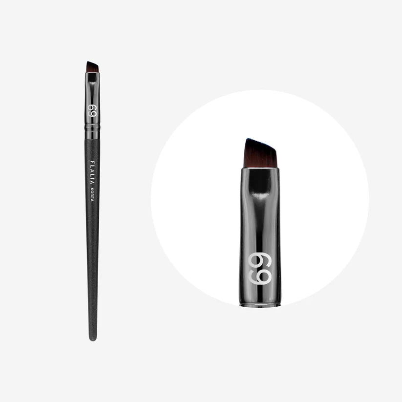 An eyebrow brush with a black handle and angled brush head designed for precise makeup application.
