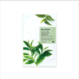 Mizon Joyful Time Essence Mask packaging with green tea leaves on a white background